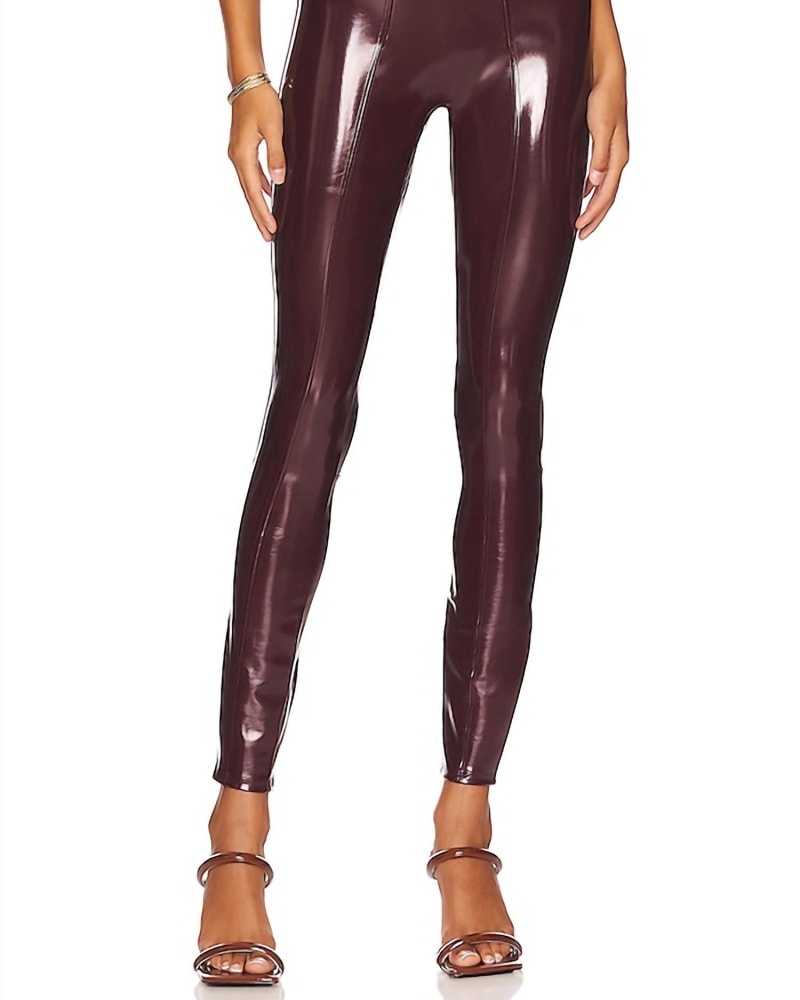 Front of a model wearing a size XL Patent Faux Leather Legging In Ruby in Ruby by Spanx. | dia_product_style_image_id:358235